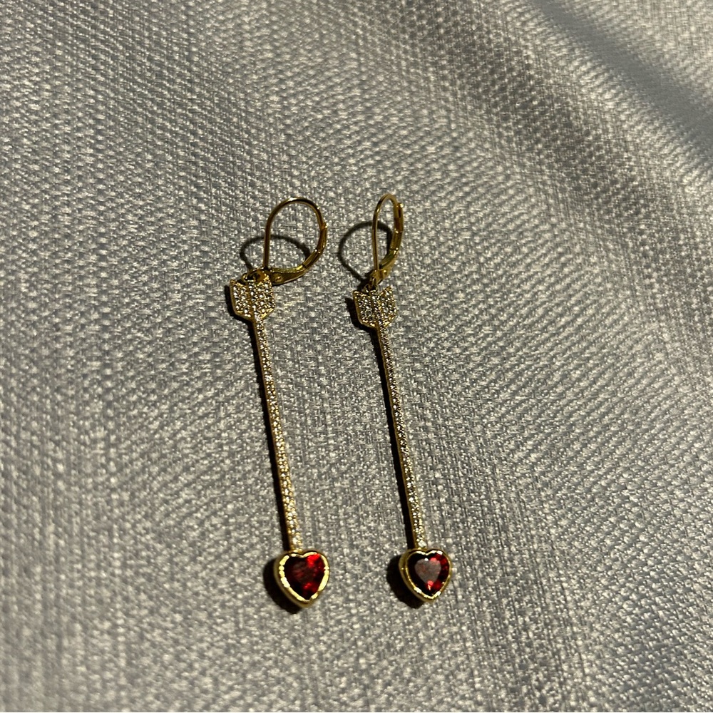 Kate Spade arrow dangle earrings.
